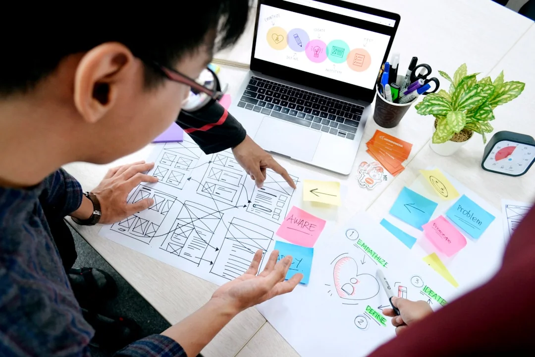 A modern computer screen displaying web design work, showcasing creative visuals in a workspace.